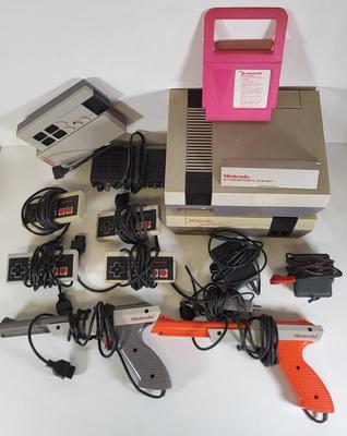 LOT 163: Two Original Vintage Nintendo NES Systems with Controllers, Duck Hunt Guns and More