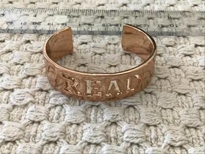 Read Bracelet. New. Rose Tone
