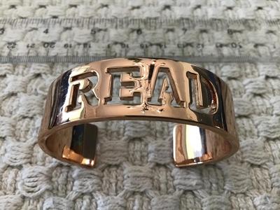 Read Bracelet. New. Rose Tone