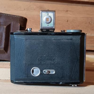 LOT 164: North American Hunting Club Collectors Coin Set and Books with Vintage Camera & Antique/Vintage Powder Horn