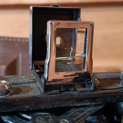 LOT 164: North American Hunting Club Collectors Coin Set and Books with Vintage Camera & Antique/Vintage Powder Horn