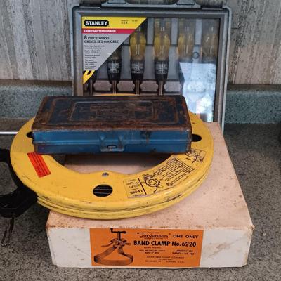 LOT 187: Whitney-Jensen Metal Working Punch, Thomas & Belts Fish Tape, Band Clamp and Stanley Chisel Set