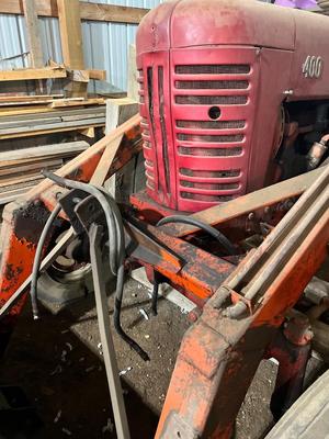 Sale Photo Thumbnail #26: Farmall 400, One of the tires is flat, there is a hydraulic issue with the bucket. Has not run in time, but did run a while ago.
