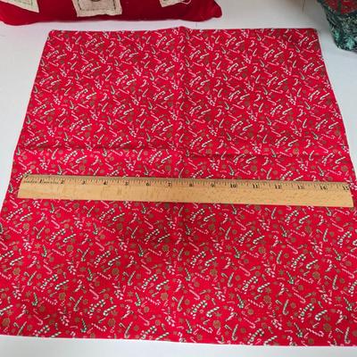 LOT 67P: Christmas Decor Including Quilted Wall Hanging, Hand-Made Coasters, Table Napkins, Cloth Basket, Round Trivets, and More