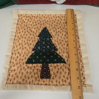 LOT 69P: Beautiful Hand-Made Christmas Decor Including Table Runners, Coasters, Two Stockings, and More