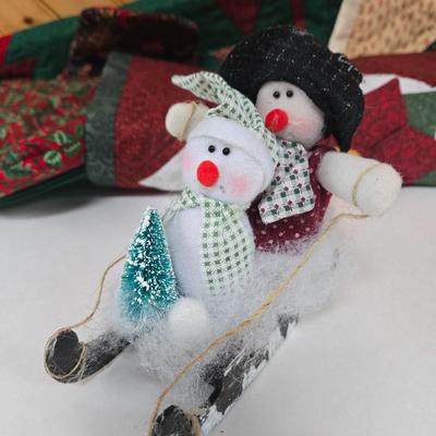 LOT 69P: Beautiful Hand-Made Christmas Decor Including Table Runners, Coasters, Two Stockings, and More