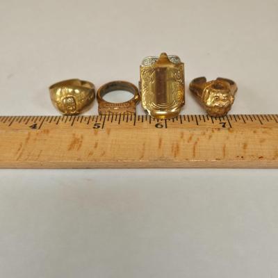 LOT 73P: Vintage Robbins Co. Saddle Ring, Toka Straight Arrow Ring, Straight Arrow Golden Nugget Cave Ring, and Straight Arrow Ring