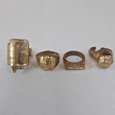 LOT 73P: Vintage Robbins Co. Saddle Ring, Toka Straight Arrow Ring, Straight Arrow Golden Nugget Cave Ring, and Straight Arrow Ring