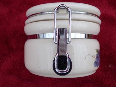 Beautiful ceramic 3 piece canister set. Locking lids,. Look like new/unused.