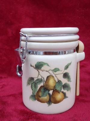 Beautiful ceramic 3 piece canister set. Locking lids,. Look like new/unused.