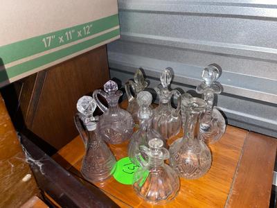 Sale Photo Thumbnail #508: Various Glass Decanters (Lot of 8). 7/8 have lids, 6/7 lids fit well. Great condition.