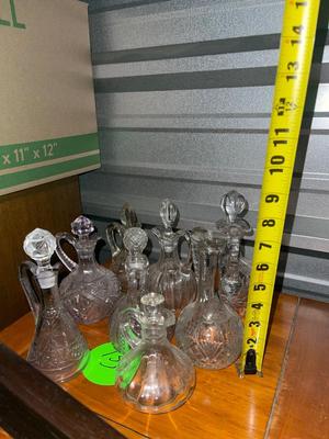 Sale Photo Thumbnail #511: Various Glass Decanters (Lot of 8). 7/8 have lids, 6/7 lids fit well. Great condition.