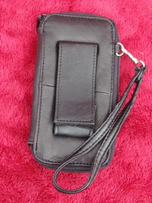 Small belt wallet. Holds c/c’s, ID, cash/change. Zips. phone pocket.