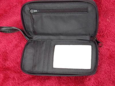 Small belt wallet. Holds c/c’s, ID, cash/change. Zips. phone pocket.