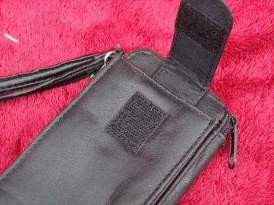 Small belt wallet. Holds c/c’s, ID, cash/change. Zips. phone pocket.