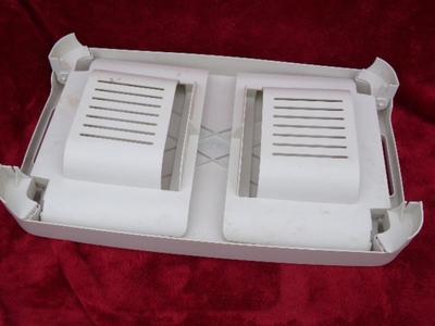 Bed tray, for eating in bed or whatever. Folds up for storage, plastic.