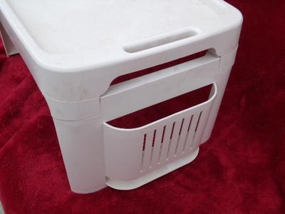 Bed tray, for eating in bed or whatever. Folds up for storage, plastic.