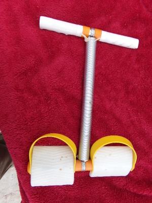 Exercise device. Place feet in syrups and pull handles with hands
