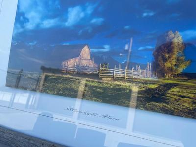 Sale Photo Thumbnail #576: Landscape Wall Art (Lot of 2). One photograph, one painting (appears to be acrylic). Similar sizes, the painting is slightly smaller.