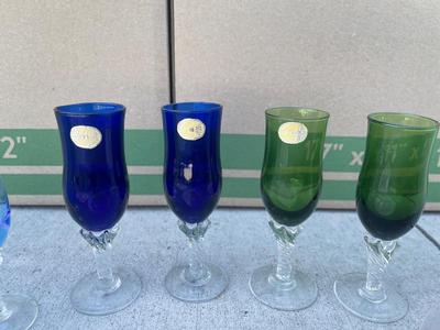 Sale Photo Thumbnail #603: Depression Glass Plates and Stemmed Shot Glasses/Candleholders (Lot of 9). 3 gorgeous pink hued glass plates, floral texture on the bottom of each. 6 small, stemmed glass cups; could be used as shot glasses, candleholders, etc.