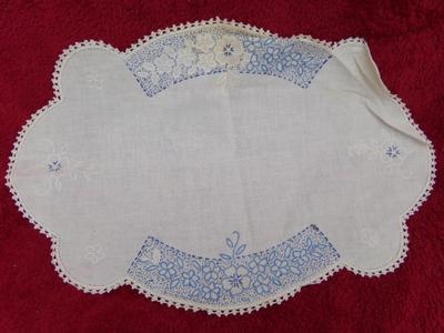 Hand crafted & embroidered table doily. About 21"x14".