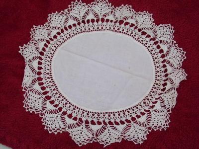 All hand crafted with care, 2 doilies and 1 small table cover/cloth.
