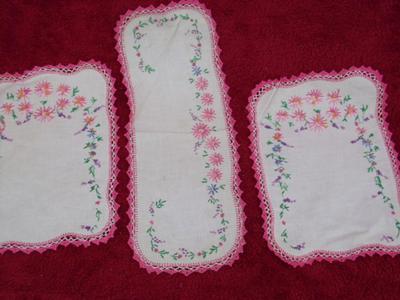 Set of 3 embroidered doilies on cotton or linen. Very nicely crafted.