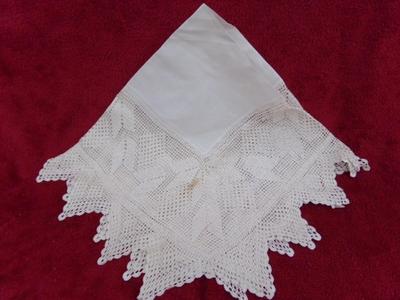 Hand crafted table throw w/crocheted perimeter and cloth center.