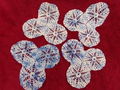 4 blue w/white hand crafted crocheted doilies. Look like lot 65.