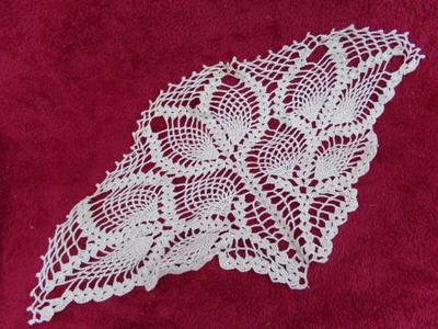A pair of triangular crocheted doilies. Maybe for a round table.