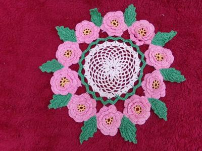 Hand crafted crocheted doily w/tufted roses. About 11" diameter.