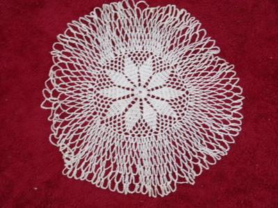 Finely detailed crocheted hand crafted doily. Starched