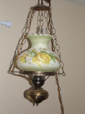 Swag lamp flash back to the 70s. Made to resemble 1800s oil lamp.