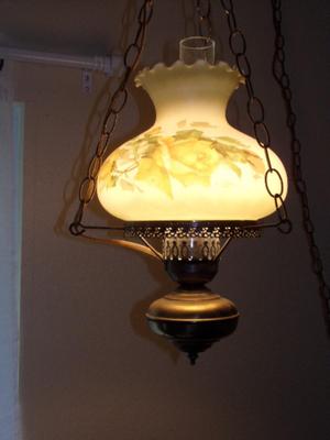 Swag lamp flash back to the 70s. Made to resemble 1800s oil lamp.
