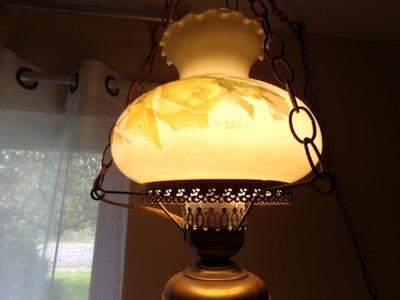 Swag lamp flash back to the 70s. Made to resemble 1800s oil lamp.