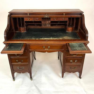 Sale Photo Thumbnail #214: Beautiful Angus of London Roll Top Tambour Desk with 8 drawers, eagle lock co brass hardware, brass pulls & know, missing one castor wheel, leather top has some wear 43" high x 48" wide x 27" deep desk height is 30.5"