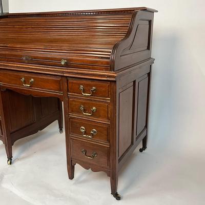 Sale Photo Thumbnail #203: Beautiful Angus of London Roll Top Tambour Desk with 8 drawers, eagle lock co brass hardware, brass pulls & know, missing one castor wheel, leather top has some wear 43" high x 48" wide x 27" deep desk height is 30.5"
