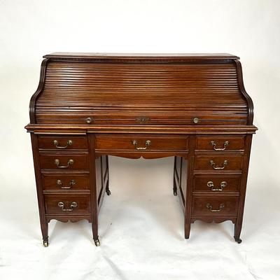 Sale Photo Thumbnail #202: Beautiful Angus of London Roll Top Tambour Desk with 8 drawers, eagle lock co brass hardware, brass pulls & know, missing one castor wheel, leather top has some wear 43" high x 48" wide x 27" deep desk height is 30.5"