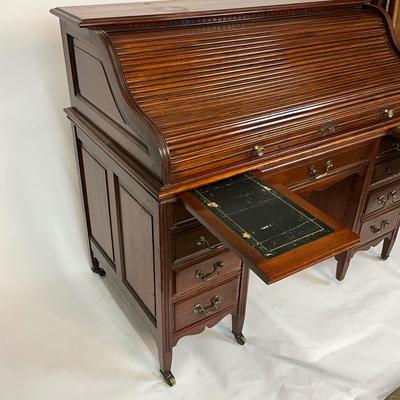 Sale Photo Thumbnail #205: Beautiful Angus of London Roll Top Tambour Desk with 8 drawers, eagle lock co brass hardware, brass pulls & know, missing one castor wheel, leather top has some wear 43" high x 48" wide x 27" deep desk height is 30.5"