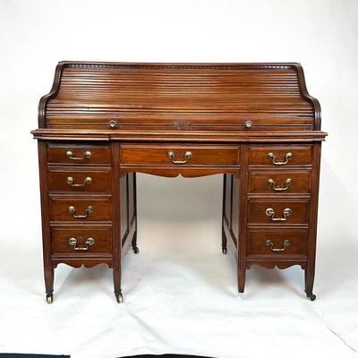 Sale Photo Thumbnail #201: Beautiful Angus of London Roll Top Tambour Desk with 8 drawers, eagle lock co brass hardware, brass pulls & know, missing one castor wheel, leather top has some wear 43" high x 48" wide x 27" deep desk height is 30.5"