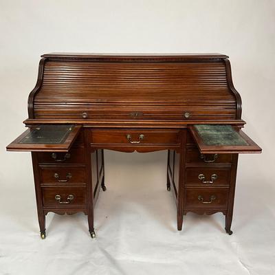 Sale Photo Thumbnail #204: Beautiful Angus of London Roll Top Tambour Desk with 8 drawers, eagle lock co brass hardware, brass pulls & know, missing one castor wheel, leather top has some wear 43" high x 48" wide x 27" deep desk height is 30.5"