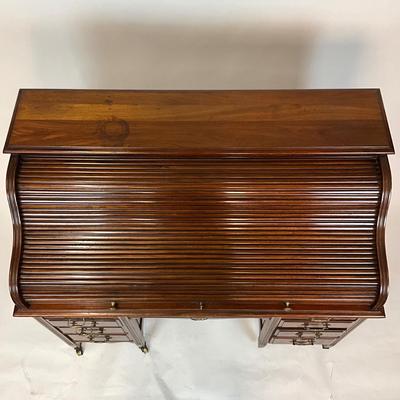 Sale Photo Thumbnail #213: Beautiful Angus of London Roll Top Tambour Desk with 8 drawers, eagle lock co brass hardware, brass pulls & know, missing one castor wheel, leather top has some wear 43" high x 48" wide x 27" deep desk height is 30.5"