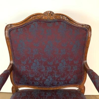 Sale Photo Thumbnail #262: magnificent example of 18th-century French craftsmanship, this Louis XV fauteuil armchair exudes elegance and comfort. Carved from rich walnut, the chair boasts a beautifully detailed frame showcasing the flowing lines and delicate asymmetry characteristi