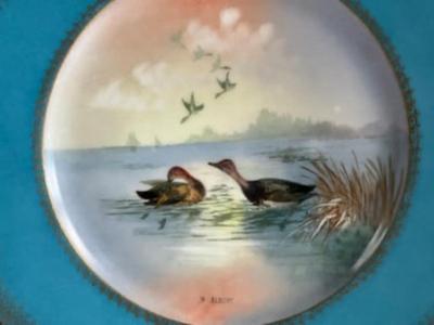 Sale Photo Thumbnail #267: Late 20th Century handprinted Avian Wildlife Plates , signed lower right in front, each plate is of a different color ( 2 yellow, 2 pink, 1-green, 1-blue) with gilt gold decorative edge. marked from the Theodore Haviland Limoges Factory very good conditio