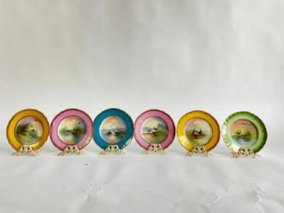 Sale Photo Thumbnail #264: Late 20th Century handprinted Avian Wildlife Plates , signed lower right in front, each plate is of a different color ( 2 yellow, 2 pink, 1-green, 1-blue) with gilt gold decorative edge. marked from the Theodore Haviland Limoges Factory very good conditio