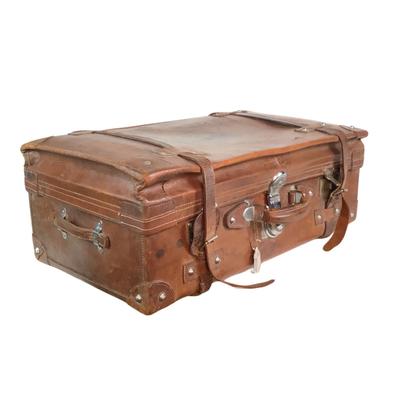 Sale Photo Thumbnail #272: Reinforced exposed straps, handles, chrome latches, includes working key, original pale blue textile interior, one ripped strapped everything else leather is intact. Rich dark leather patina. 30" wide x 11.5" high x 17" deep.