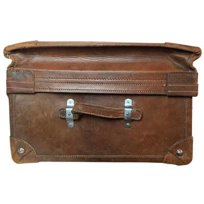 Sale Photo Thumbnail #277: Reinforced exposed straps, handles, chrome latches, includes working key, original pale blue textile interior, one ripped strapped everything else leather is intact. Rich dark leather patina. 30" wide x 11.5" high x 17" deep.