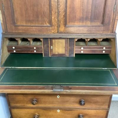 Sale Photo Thumbnail #294: With Ivory Esutcheons on the desk drawer pulls,and key holes. This piece would make a wonderful addition to any collector. The leather top on the desk has been completely restored with kelly green gold border leather. Comes in two pieces and Ogee feet. Ch