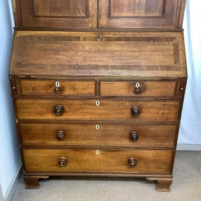 Sale Photo Thumbnail #296: With Ivory Esutcheons on the desk drawer pulls,and key holes. This piece would make a wonderful addition to any collector. The leather top on the desk has been completely restored with kelly green gold border leather. Comes in two pieces and Ogee feet. Ch