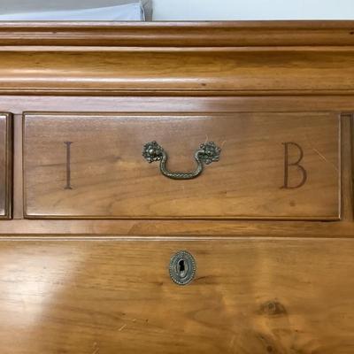 Sale Photo Thumbnail #306: This highboy is 2 piece's, made of a mix of cherry and pine; cabriole legs with fluted snake feet; on the very top center drawer it has inlay with the initials "I & B"; total of 11 drawers that are dovetail jointed, with a mixture of different brass pulls